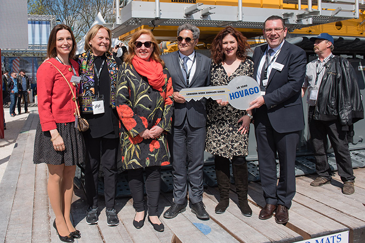 Liebherr hands over a symbolic key for several new LR 1500 cranes to Hovago at the Bauma.