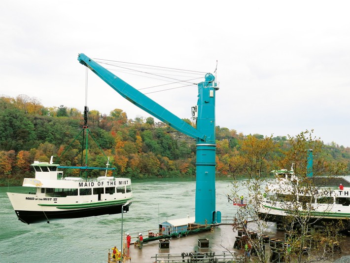 Liebherr heavy lift fix mounted crane is used for lifting tour boats at