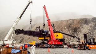 Liebherr LTR 1220 telescopic crawler crane assembling a mining excavator.