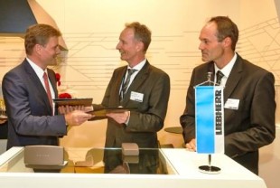 Andreas Busemann, Member of the Board (Production) of DB Fernverkehr AG (left), with Dirk Junghans, Managing Director Sales, Marketing and Customer Service (middle) and Andreas Buhl, Managing Director Research and Technology (right), of Liebherr-Transportation Systems GmbH & Co KG, at the contract signature ceremony during InnoTrans 2014