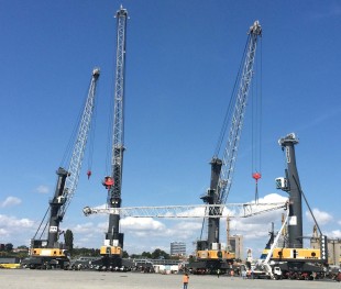 Two LHM 550s assist with the assembly of a new LHM 550 in Italy.
