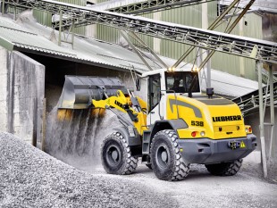 The Liebherr L538 wheel loader in operation, preparing and maintaining stockpile areas for loading into trucks, crushers, and/or plant hoppers.