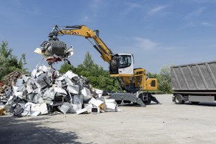 The Liebherr LH 22 M material handler loading a truck