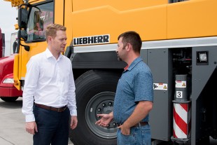 Daniel Pitzer of Liebherr, left, and Paul Prillaman, owner of Prillaman’s Crane & Rigging Co.