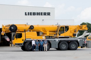 Daniel Pitzer, Paul Prillaman, David Kaufman and Bret Jacobson celebrate the handover of an LTM 1090-4.2 to Prillaman’s Crane & Rigging at Liebherr USA, Co. headquarters.