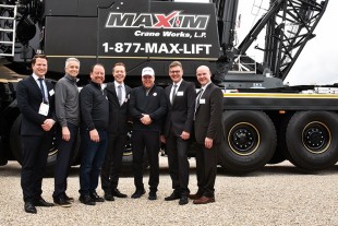 Liebherr USA, Co. mobile crane division leaders and the leadership of Maxim Crane Works following the handover of an LTM 1650-8.1 mobile crane on the first day of Conexpo 2020.