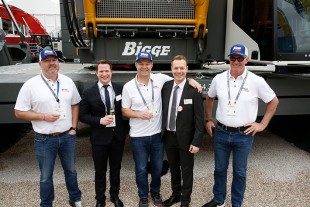 Liebherr USA, Co. mobile crane division leaders and the leadership of Bigge Crane and Rigging Co. following the handover of an LR 1800-1.0 crawler crane on the first day of Conexpo 2020.