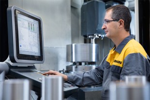 Liebherr employee designing high-quality OEM parts for appliances.